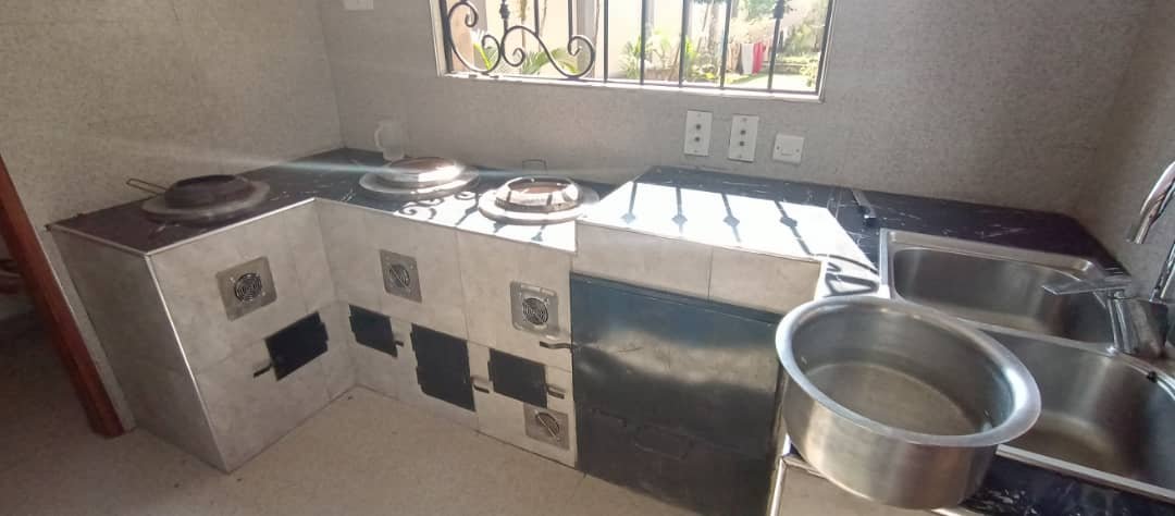 Solar-aided volcanic rock cookstove